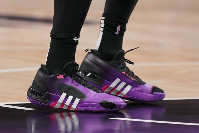 Cleveland Cavaliers guard Donovan Mitchell's purple and black adidas sneakers.